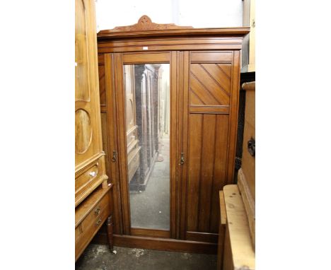 Late 19th / early 20th Century walnut bedroom suite comprising:  three door wardrobe, dressing table with jewel drawers and s