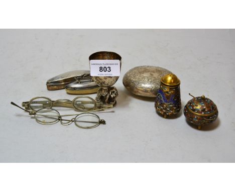 Silver elephant egg cup, two silver nail buffs, cheroot holder case, two enamel condiments, an oval silver snuff box and two 