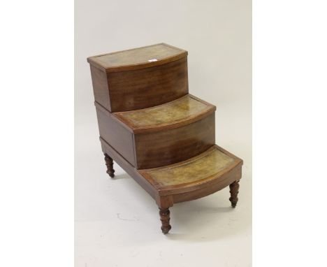 Late George III mahogany three step commode with leather inset treads, the upper with a hinged lid opening to reveal the void