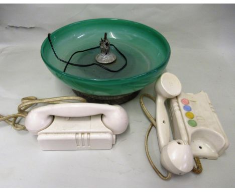 Two Art Deco Bakelite cased wall telephones together with an Art Deco green glass and silver plate mounted table centre 