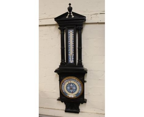 Late 19th / early 20th Century carved and ebonised barometer / thermometer with painted dials, 103cms high 