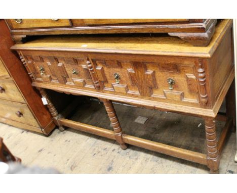 Early 20th Century oak dresser with two moulded front drawers on bobbin turned supports with periphal stretcher, 86cms high x
