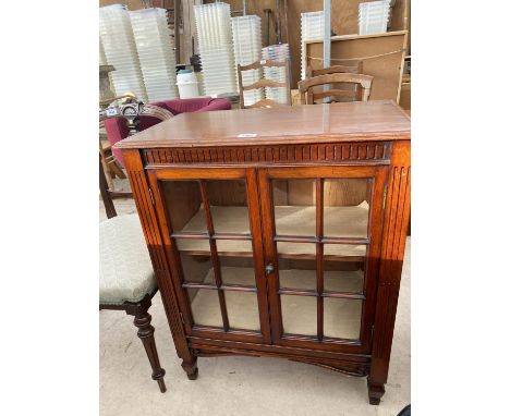 A MAHOGANY CABINET WITH TWO GLAZED PANEL DOORS 