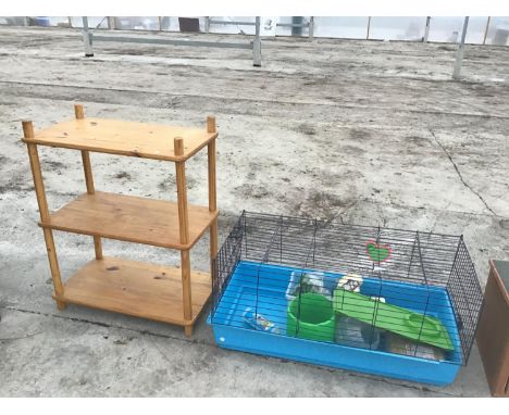 A LARGE INDOOR PET CAGE WTH ACCESSORIES AND A PINE THREE SHELF UNIT 