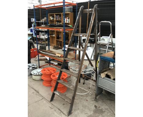 A VINTAGE WOODEN STEP LADDER AND A WROUGHT IRON SEMI CIRCULAR TABLE WITH FROSTED GLASS TOP 