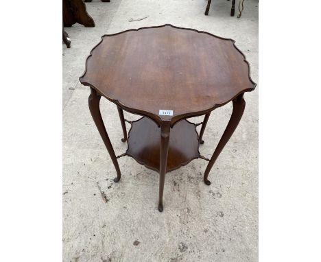 A MAHOGANY OCCASIONAL TABLE WITH PIE CRUST EDGE AND LOWER SHELF 