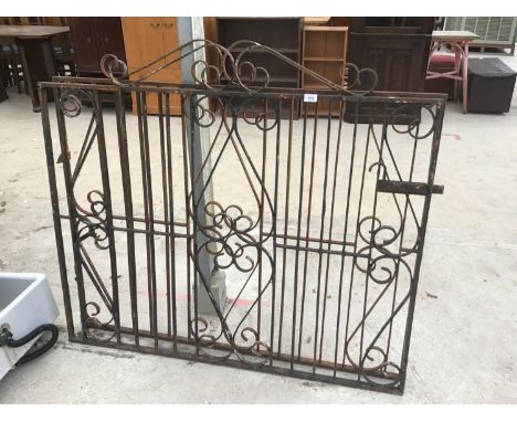 A PAIR OF ORNATE WROUGHT IRON GATES EACH GATE 128CM X 112CM TO HIGHEST POINT 