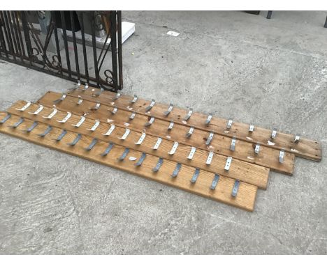 FOUR BOARDS WITH COAT HOOKS 