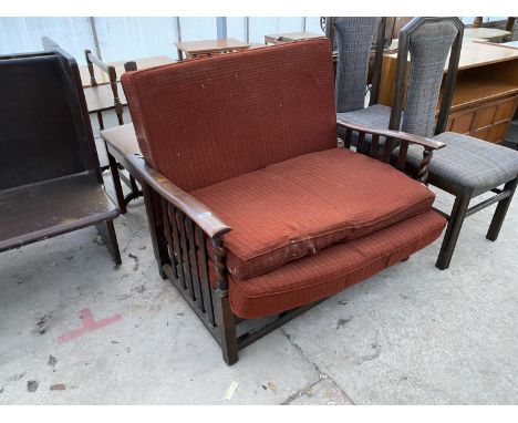 AN OAK TWO SEATER SOFA WITH ADJUSTABLE BACK REST 