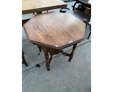 AN OCTAGONAL MAHOGANY SIDE TABLE WITH LOWER SHELF 