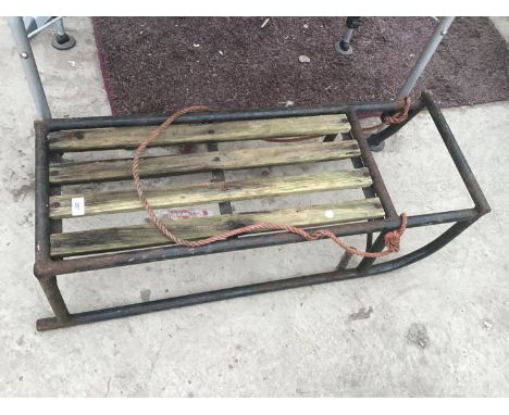 A VINTAGE METAL SLEDGE WITH WOODEN SEAT 