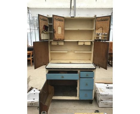 A VINTAGE EASIWORK STREAMLINE DELUXE MODEL KITCHEN CABINET WITH ACCESSORIES TO INCLUDE JARS, EGG DRAWER, ICING SET DRAWER, PA