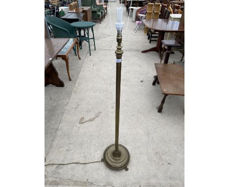 A BRASS STANDARD LAMP ON CIRCULAR TRIPOD SUPPORT 