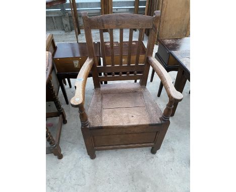AN OAK COMMODE 
