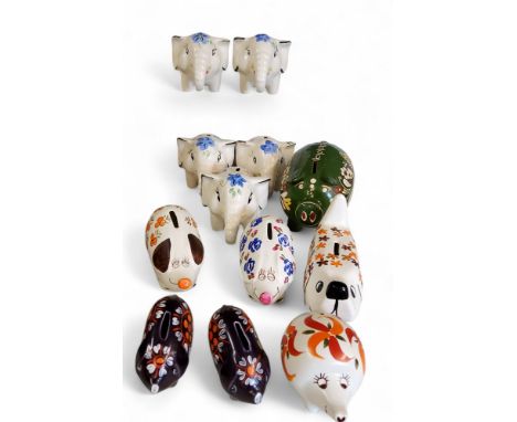Five Arthur Wood money banks, in the form of comical elephants, painted in colours with stylised flowers, printed marks'&nbsp
