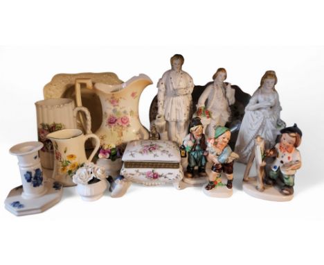 A pair early 20th century bisque figures, of a gallant and companion, standing in 18th century dress, holding parrots, beaded
