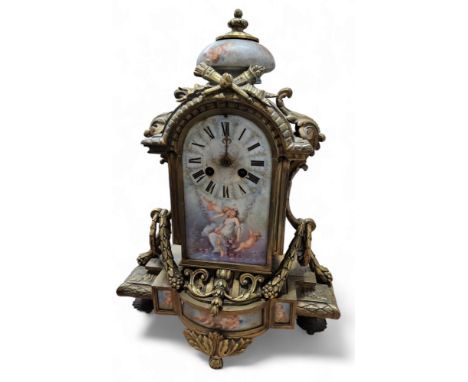 A 19th century French ormolu and porcelain&nbsp; mantel clock, arched rectangular dial with Roman numerals, twin winding hole