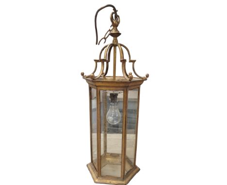 A George III style gilt metal hexagonal hall lantern, scroll mounts, 62cm high