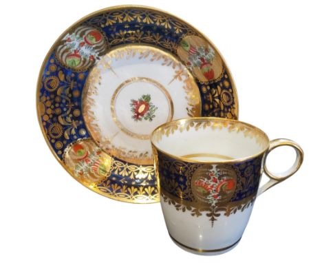 A Chamberlain's coffee cup and saucer, painted with a rich blue and gilt border containing Kakiemon panels in the style of th