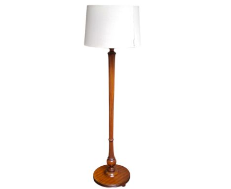 A modern flamed mahogany standard lamp with shade
