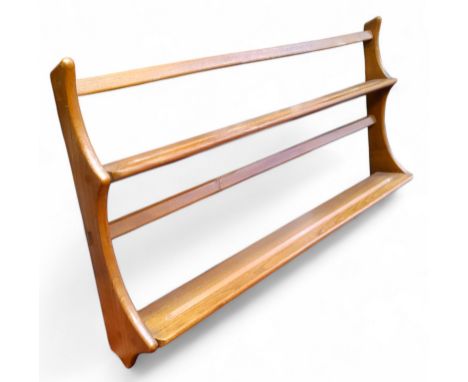 A mid 20th century Ercol 'Golden Dawn' model plate rack, 50cm high,  97cm wide,  14cm deep