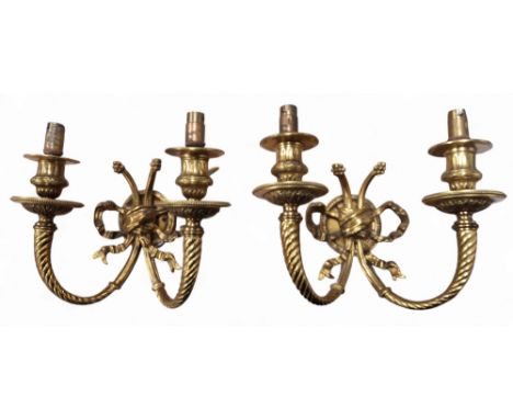 A pair of gilt metal two light, two branch wall lights, ribbon tied spirally turned arms, 24cm wide