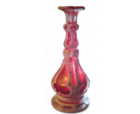 An Art Nouveau &nbsp;Czechoslovakia&nbsp; Bohemian Moser cut cranberry glass vase, overlaid in white, picked out in gilt,&nbs