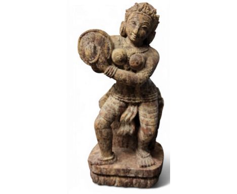 An Indian&nbsp; sandstone goddess, standing playing cymbal, 33cm high, mid 20th century;&nbsp; &nbsp; an Indian miniature pai