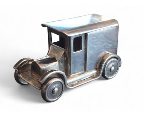 An apprentice-piece white metal model loosely based on a Ford Model A panel van, rotating wheels, tests as silver, 60mm long&