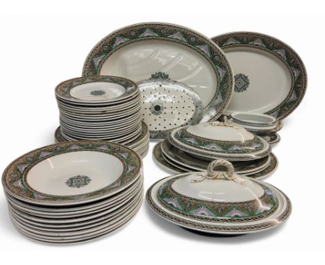 A late 19th century Copeland dinner service, banded with stylised flowers in demi-triangles and thistles, in tones of green, 