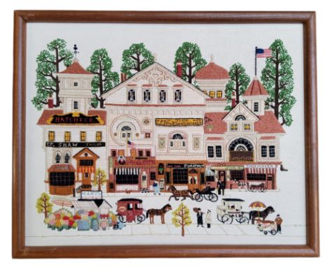 American Folk Art - a well executed needlepoint embroidery panel depicting an American street scene, each shopfront with stit