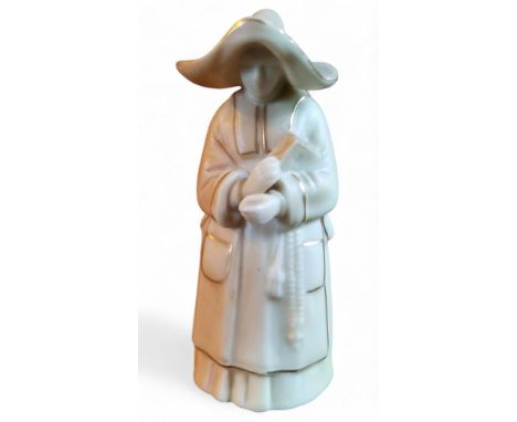 A Royal Worcester candlesnuffer,&nbsp; of a nun,&nbsp; in blush ivory, picked out in gilt,&nbsp; printed mark in puce, date c