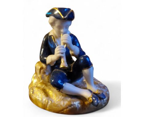 A&nbsp; Royal Worcester figure, of a Musician, as a seated boy, in 18th century costume, he playing a pipe, on rocky moulded 