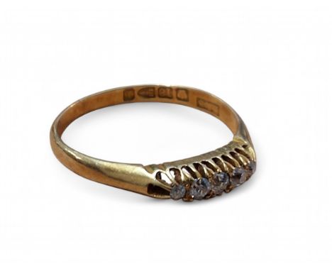 A late Victorian 18ct gold and diamond gypsy ring, set with five graduated old cut diamonds the largest approx. 2mm dia., siz