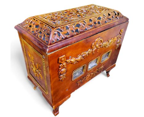 A late 19th century French cast iron enamelled 'Mirus' stove with pierced caddy top and floral and ribbon motif to front, wit