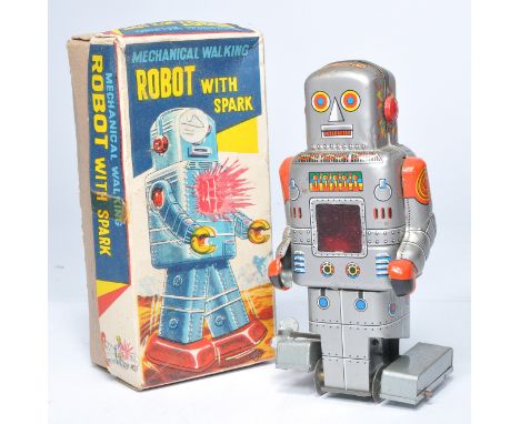 SY Toys Japanese Tinplate Mechanical Robot 'with spark' (17cm). Displays good to very good with minor age related wear, in ve
