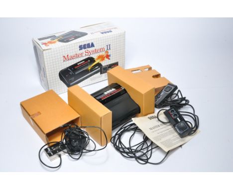 Sega Master System II Video Gaming Console. Looks to be complete with original box. Untested. 