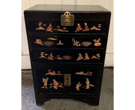 A 20th century Majestic Co, Hong Kong ebonised hardwood cabinet, the top opening to a deep section with removable cutlery sto