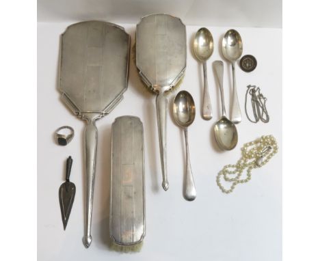A silver hand mirror, with matching hair brush and clothes brush; a Georgian silver fork; four silver tea spoons; an Edwardia