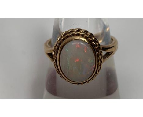 A 9 carat gold opal dress ring, finger size K, 3.3g gross