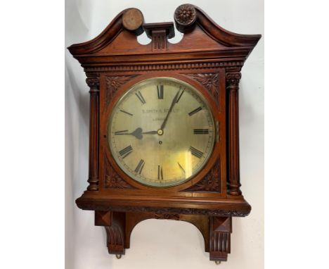 An eight day fusee movement mahogany cased wall clock retailed by S. Smith &amp; Son Ltd, London, circa 1900, the round brass
