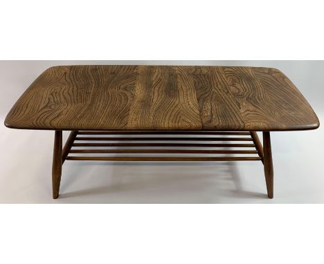 An Ercol elm rectangular coffee table with stick under tier, 106cm long