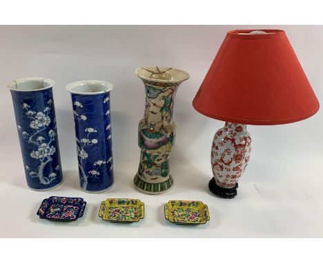 A pair of Chinese vases, each decorated with prunus trees along with single Chinese vase, lamp and three enamel dishes
