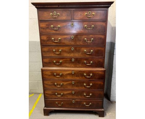 A 19th century walnut chest on chest of two short and eight long drawers on shaped bracket feet, with later brass handles, 18