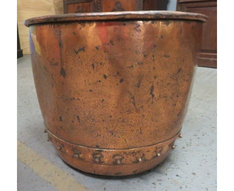A large 19th century Victorian copper wash bin/planter of industrial size having a riveted construction and rolled rim, 37cm 