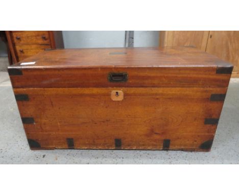 An early Victorian mahogany travelling trunk, with metal banded sides and corners, vacant plaque to the hinged lid, carrying 