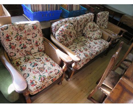 An oak framed single cane bergere suite comprising two seater sofa and two armchairs 