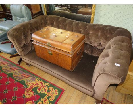 A brown upholstered button back Chesterfield two seater settee 