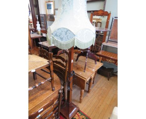A mahogany standard lamp with square column and base and green shade (sold electrically untested) 