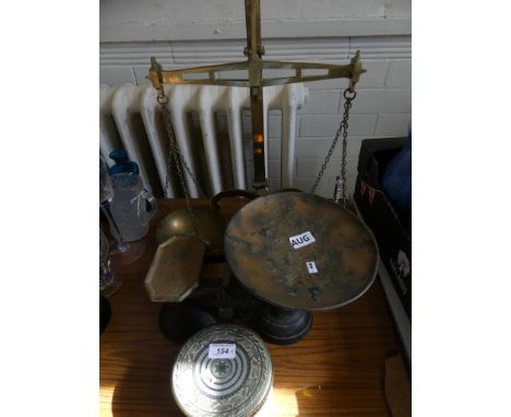 A mixed lot comprising a pair of brass beam scales, together with further iron scales and a quantity of weights 